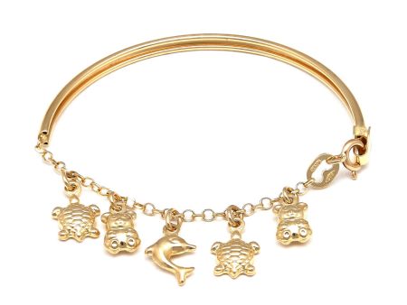 Pulsera infantil eslabón cruzado con aplicación, colgantes motivo tortugas, osos y delfín en oro amarillo 14 kilates. Supply